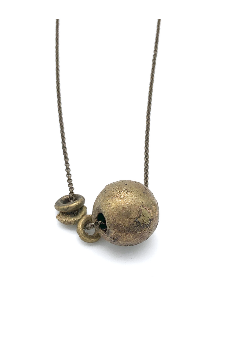 This necklace is unique in that it is a bit shorter in length than a traditional necklace which makes it perfect for layering!  Handmade in Minnesota Recycled brass beads from Ghana